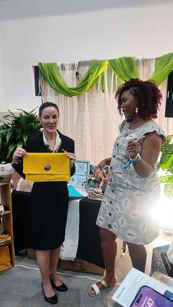 Senator Kamina Johnson-Smith with the Ayanna Tropicale Clutch Purse  and designer Fiona Kimberly at the jamaica Diaspora event